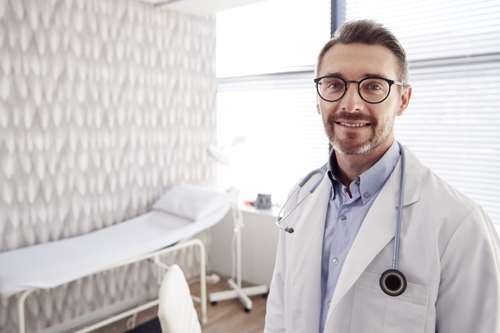 smiling doctor wart treatment